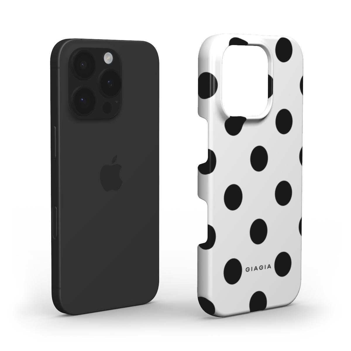 Black phone case next to a polka dot phone case on a white background